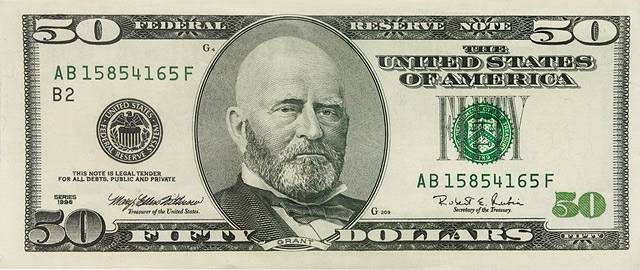 Vemos un billete de cincuenta dolares en color verde como todos  con la figura presidencial en la mitas esta aparece sin pelos
