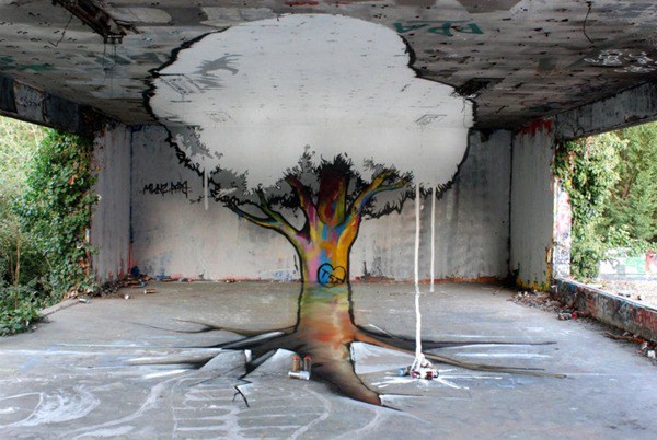 Un árbol en un cuarto el tallo lo tiene de colores y sus hojas son blancas del color del cemento
