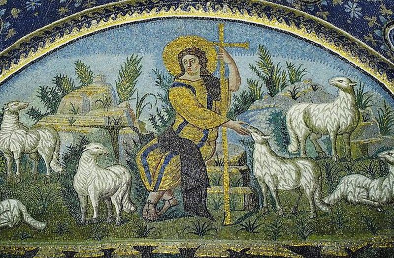 Imagen de un pastor rodeado por ovejas