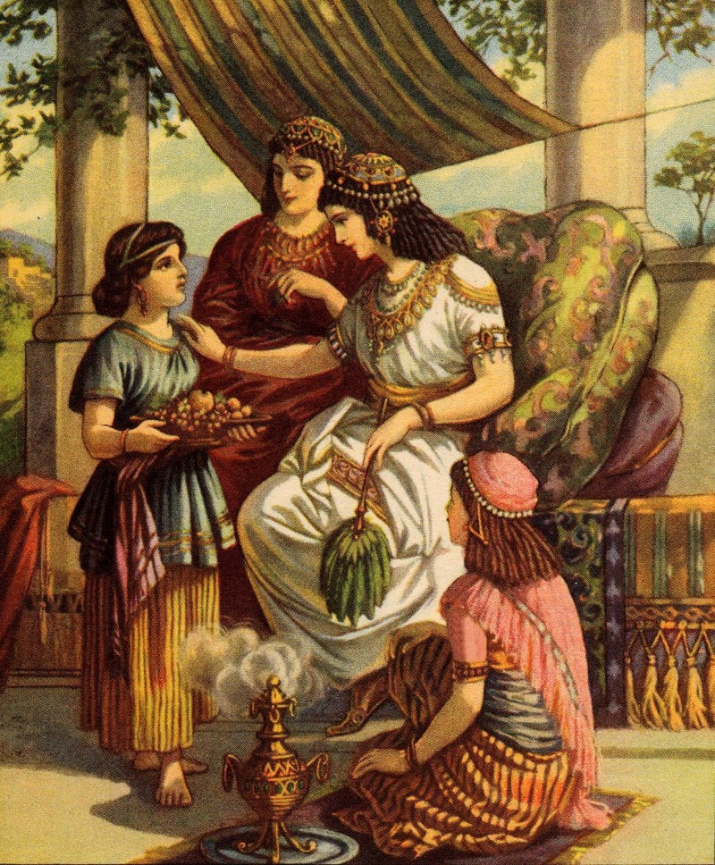 Una mujer sentada rodeada de otras mujeres de diferentes edades